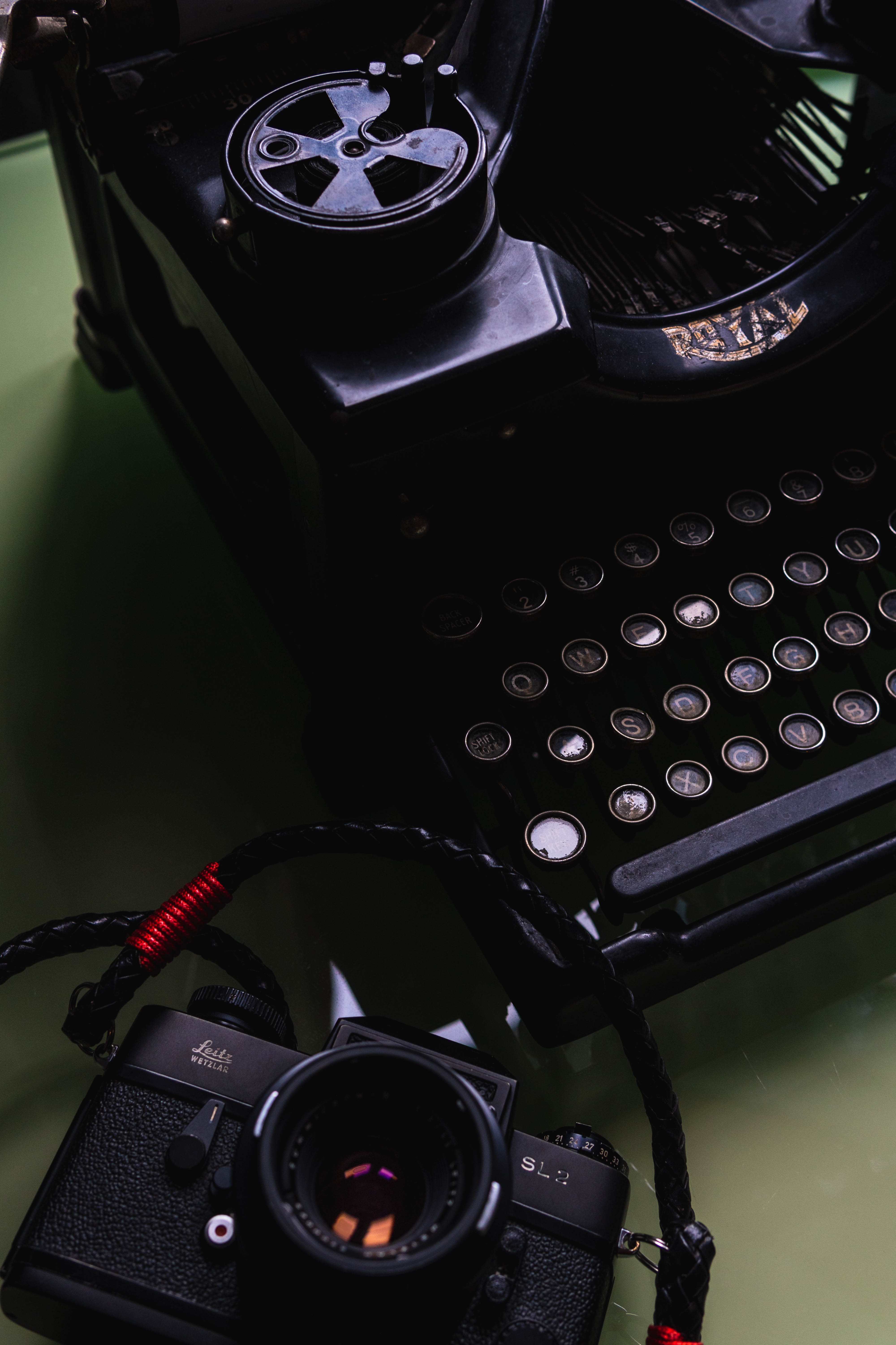 black typewriter on green table